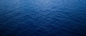 Calm deep ocean water surface under daylight