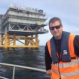 Fathom Resources team member near offshore platform